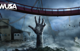 A hand rises from the ground in a spooky scene with a roller coaster, fog, and a building in the background.