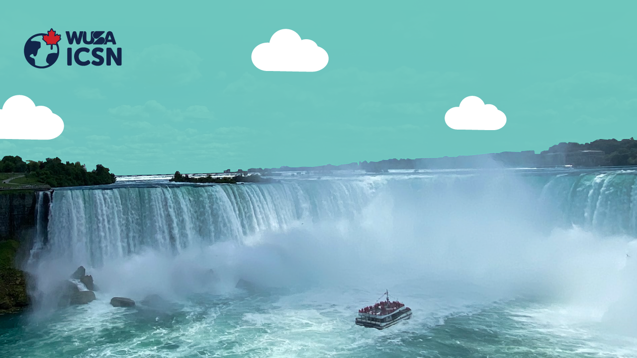 Scenic view of the famous Niagara Falls, a renowned tourist attraction, with a tour boat below. Text on image: "WUSA ICSN" with a globe and maple leaf icon.