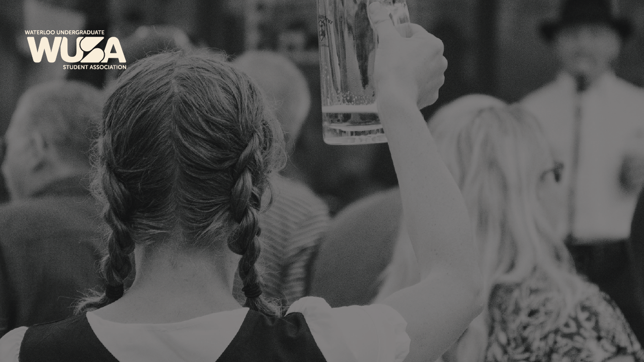 Person with braided hair raises a beer mug at a gathering; "WUSA" logo visible in the corner.